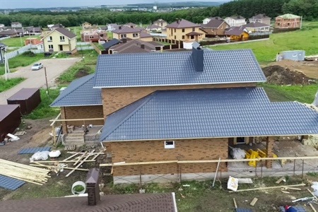 Aerial view of black asphalt shingle roofing.