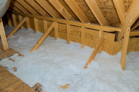 Insulation along wall of attic.